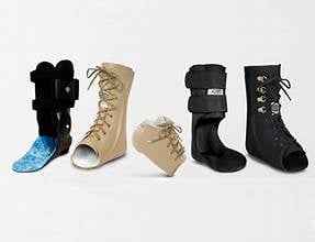 Five womens boots in black, beige, and tan colors displayed in a row against white background